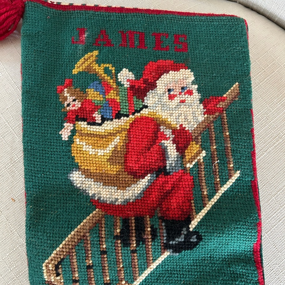 Vintage needlepoint Santa Christmas Stocking with the name, James